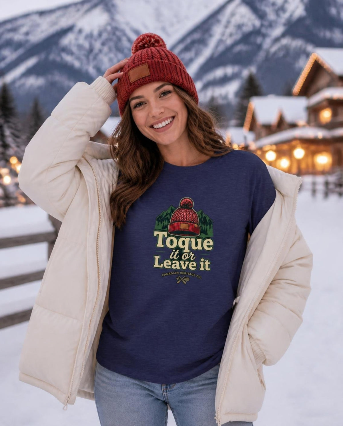 Woman wearing a navy Toque it or Leave It t-shirt in a snowy ski village
